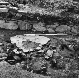 Excavation photograph showing working area looking NW - hearth, stake holes and outer face of dun wall at area KL-8-9
Duplicate photographic print available in MS/1179/1