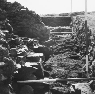 Excavation photograph of timber floor at entrance to dun
Duplicate photographic print available in MS/1179/1