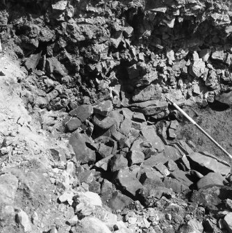 Excavation photograph showing view down into section from remaining half of OP8 wall
Duplicate photographic print available in MS/1179/1
