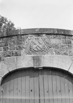 View of old dormer head heraldic panel over corner archway, St Mary's Church burial ground, Banff.