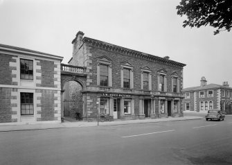 General view of front of building, Town Hall, Castle Street, Banff, showing the premises of D W Innes, butcher and Jas. Wilson, fancy goods and draper.