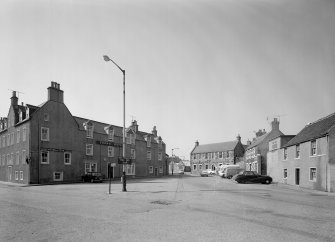 General view showing Crown Hotel, 4 Market Place and premises of Banffshire Journal, 9 Old Market Place and other buildings around square, Banff.