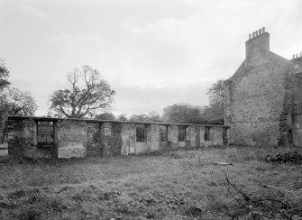 View of remains of demolished wing's east wall, Broxmouth Park, from north west.