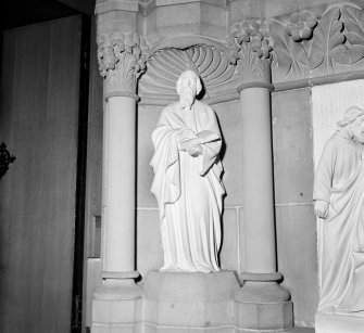 Interior view of Trinity Free Church, Irvine, showing detail of stone figure and niche.