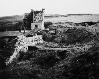 Excavation photograph: entrance gate and modern house from west.