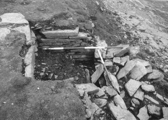 Tres Ness, Sanday. 
Central chamber of eroded chambered cairn.
