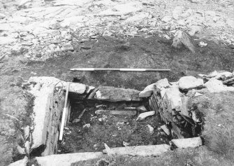 Tres Ness, Sanday. 
Central chamber of eroded chambered cairn.