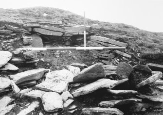 Tres Ness, Sanday. 
Section through eroded chambered cairn.