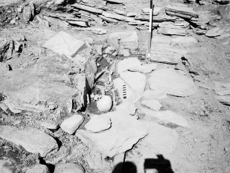 Excavation photograph : Grave II by broch wall.