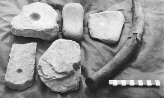 Excavation photograph : querns and horn.