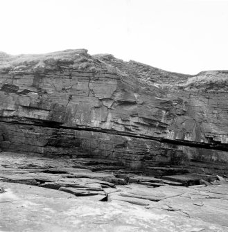 Excavation photograph : cliff face, beneath site.