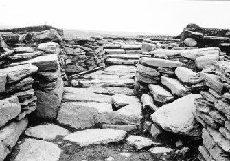 Excavation photograph : view along secondary extension to broch passage, looking SE.