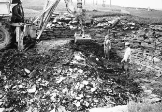 Excavation photograph : excavating interior of broch by JCB.