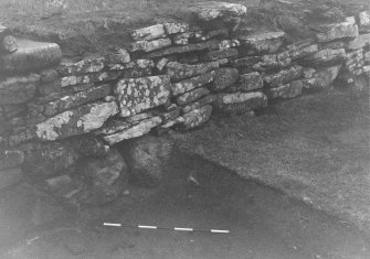 Trench 1, Area B. North wall of outbuilding.  From South-West.