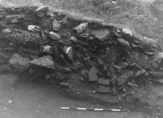 Trench 1, Area A. East wall of outbuilding.  From West.