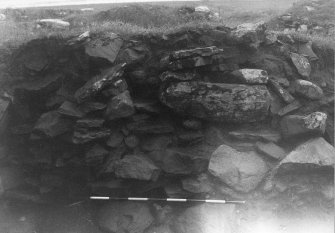 Trench 1, Area A, East wall of outbuilding.  From west.