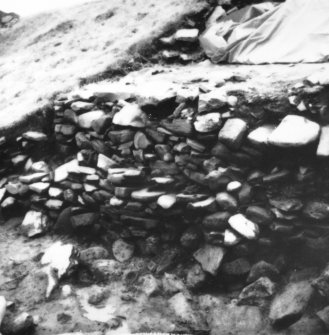 Excavation photograph -  Trench 1, area A, extension - F3 and 4 at their E extent, from NW.
Photographic copy of polaroid print. Copied 1995.