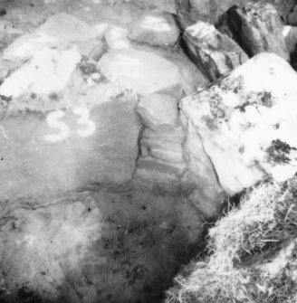 Excavation photograph -  Uprights of upper paved feature with drystone walling between trench 1/area A.
Photographic copy of polaroid print. Copied 1995.