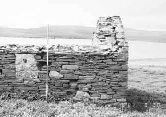 Survey photograph : site 51c - southern end of front elevation of agricultural building of drystone construction.