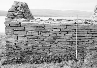 Survey photograph : site 51c - northern end of front elevation of agricultural building of drystone construction.