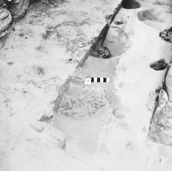 Excavation photograph.  Cell 9  Pits with burials.  Pits 5, 2, 3 also pit 4 with crucible.
(1994 copy from original colour neg.)