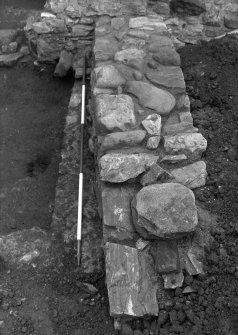 Excavation photograph - Area 5: N wall F032 - from E