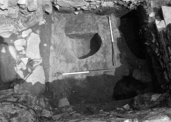 Excavation photograph - Area 5: pit F033 cut into subsoil
