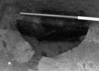 Excavation photograph - Area 5: pit F037 partially excavated