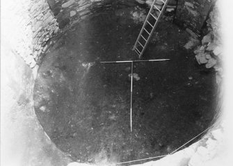 Excavation photograph : interior of tower after removal of f104, from NW.