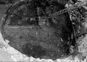 Excavation photograph : close up of base of tower after removal of f106 from NE quadrant of tower, from W.