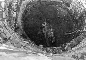 Excavation photograph : interior of tower after removal of layer f109.