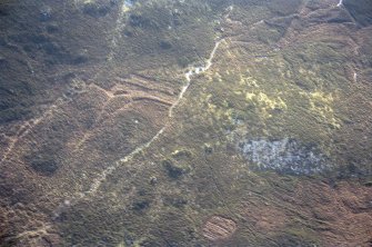 Overhead aerial view of hut circle at N end of The Ord, near Lairg, Sutherland, looking S.