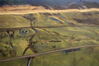 An oblique aerial view of Cinn Trolla Broch, Kintradwell, Loth, East Sutherland, looking SW.