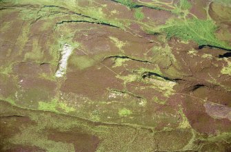 An oblique aerial view of a long cairn on a ridge to the west of South Yarrows Farm, Wick, Caithness, looking E.