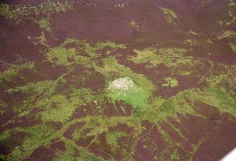 An oblique aerial view of Burg Ruadh (Bogroy) broch, Latheron, Caithness, looking NW.