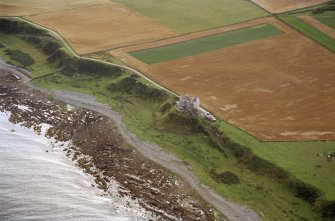 Aerial view of Ballone Castle E of Portmahomack, Tarbat Ness, Easter Ross, looking SW.