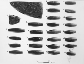 Publication photograph of beads used in the necklace report by Jean Comrie a draft of which is filed under MS/882/6.  The photograph is hand numbered in ink.