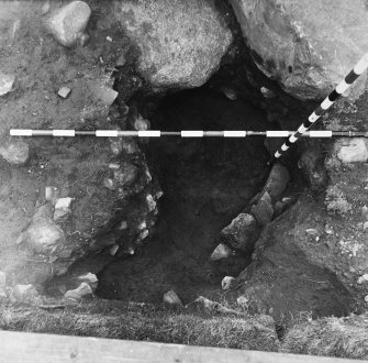 Excavation photograph - pit outside E end of longhouse