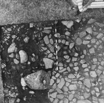 Excavation photograph rough cobbling in long house