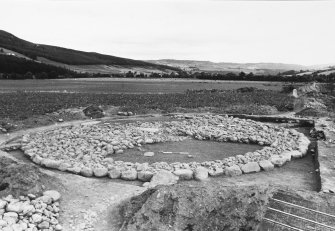 Excavation photograph : cairn, stone filling - 2 quadrants off, from south-west.