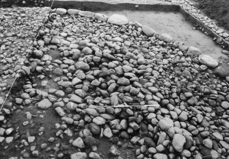 Excavation photograph : cairn from above - south-west sector, cleaned to structural level.