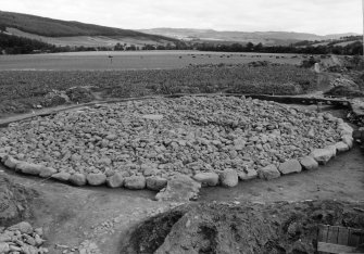 Excavation photograph : cairn stripped to structure level, from west.