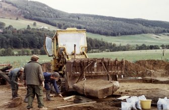 Sketewan, excavation of cairn. Lifting of massive cist-slab: Roger Mercer directing.