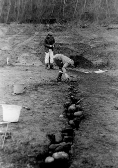 Excavation photograph.  Features 1. N end of palisade trench.