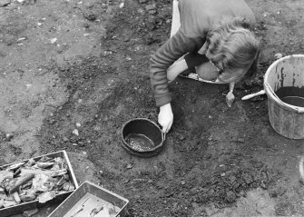 Staved wooden bowl being excavated.