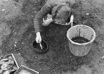 Staved wooden bowl being excavated.