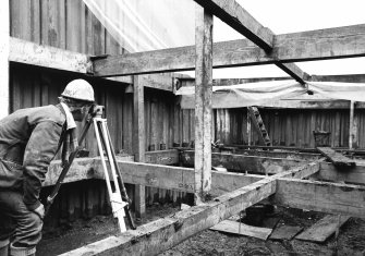 Surveying in progress in attic area.