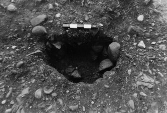 Excavation photograph : area 7 - F7066 - half section immediate packing from north.