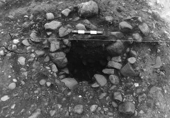 Excavation photograph : area 7 - F7084 - half section intermediate showing B excavated.