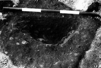 Excavation photograph : F8031 - post hole half section.